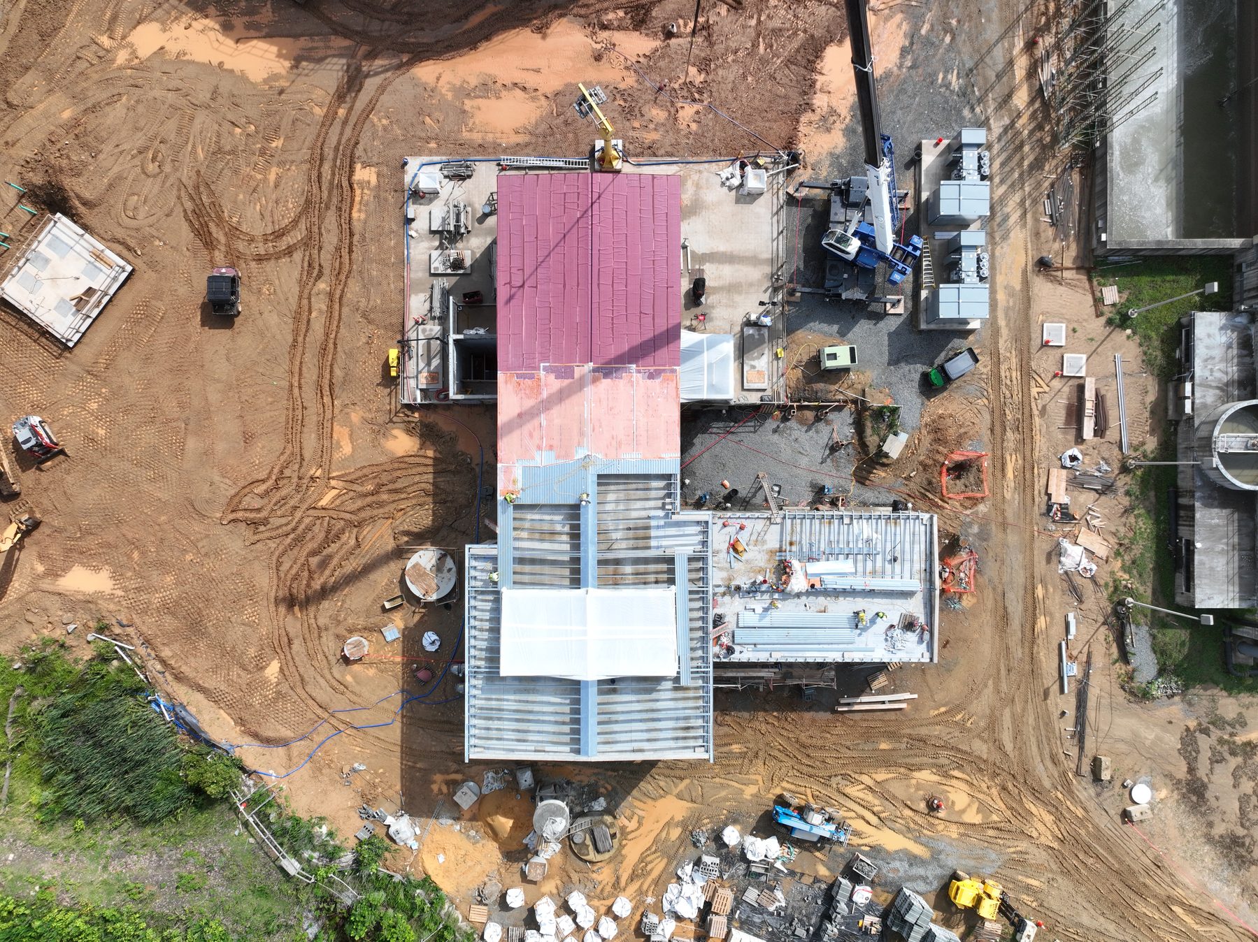 Second aerial angle of the water treatment facility showing equipment and grading