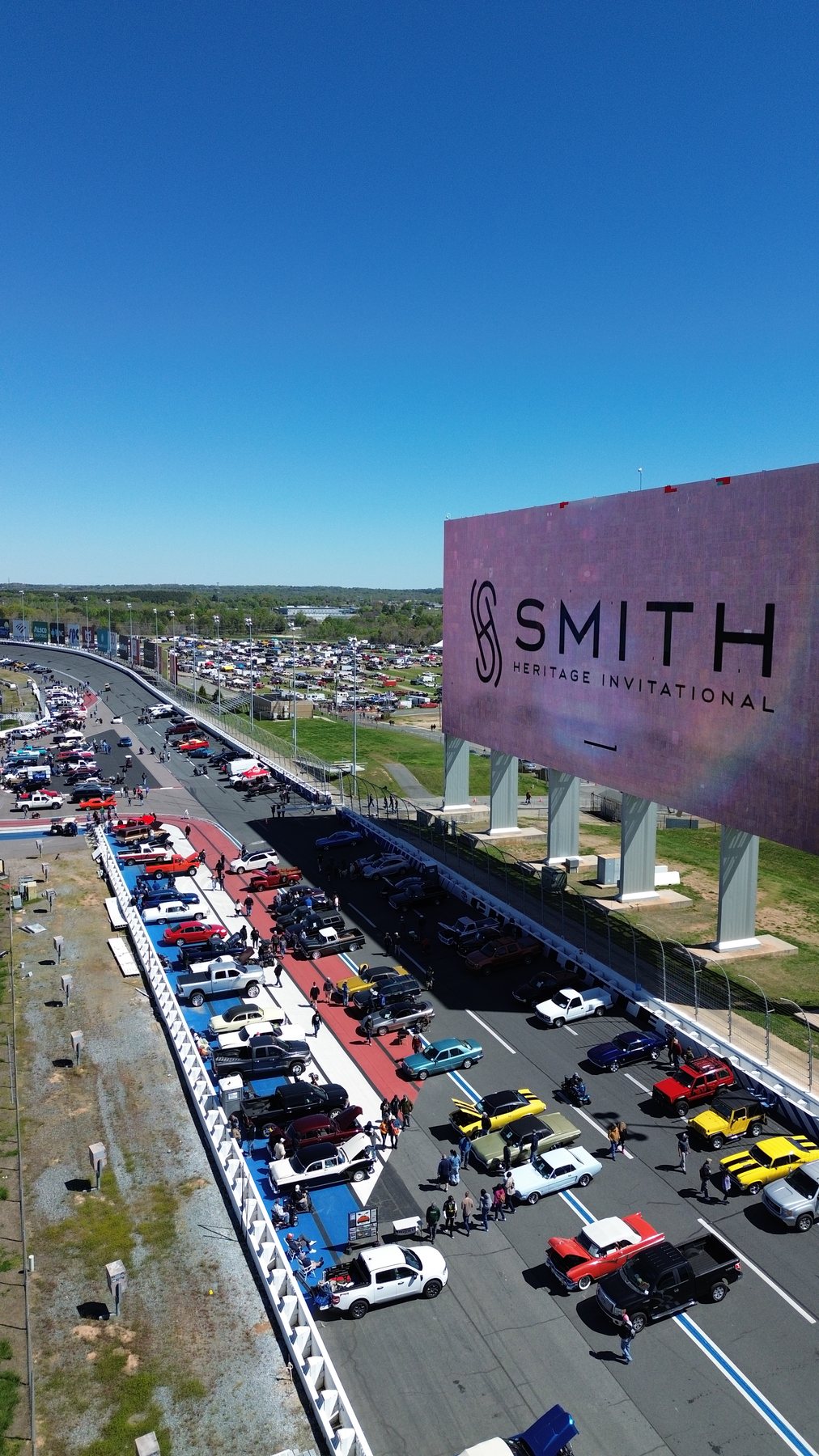 Aerial view of the Smith Heritage Invitational car show along the frontstretch at Charlotte Motor Speedway